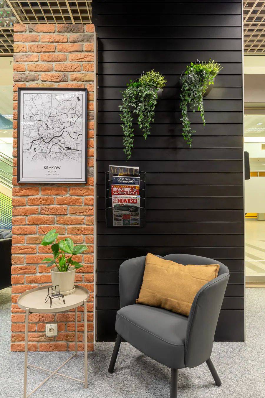 Quiet reading corner with an armchair, plants and magazines